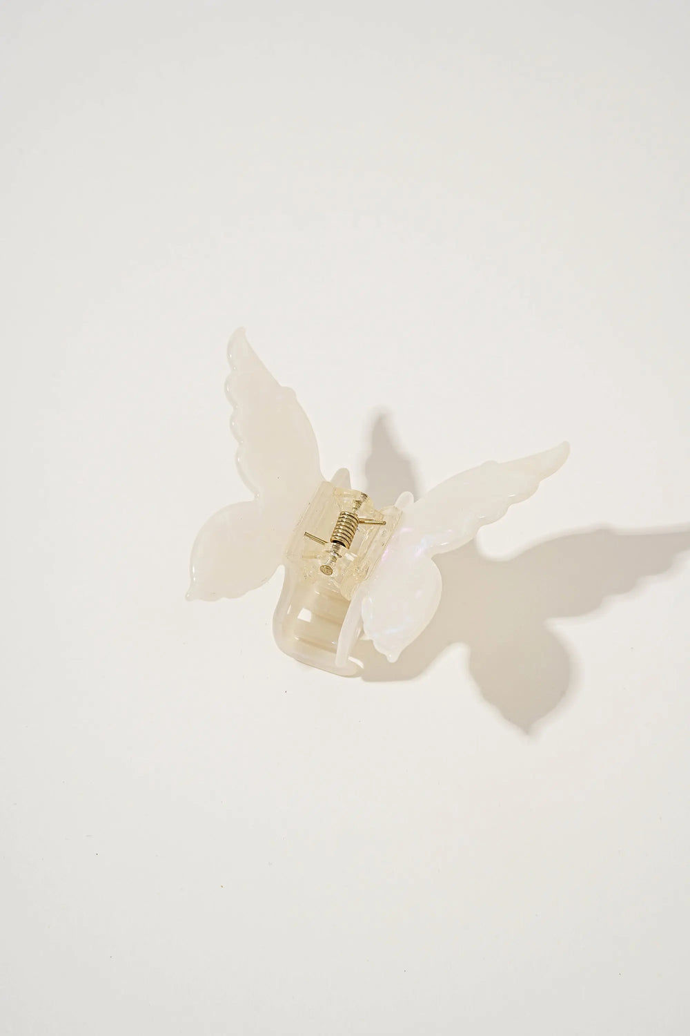 An image of a   Glossy Marbled Butterfly Hair Claw by  Mirra Masa