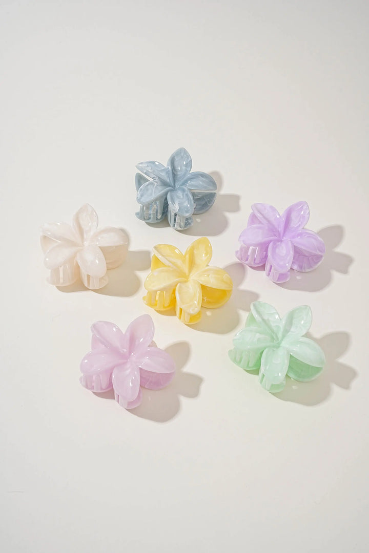 An image of a   Glossy Marbled Flower Hair Claw by  Mirra Masa