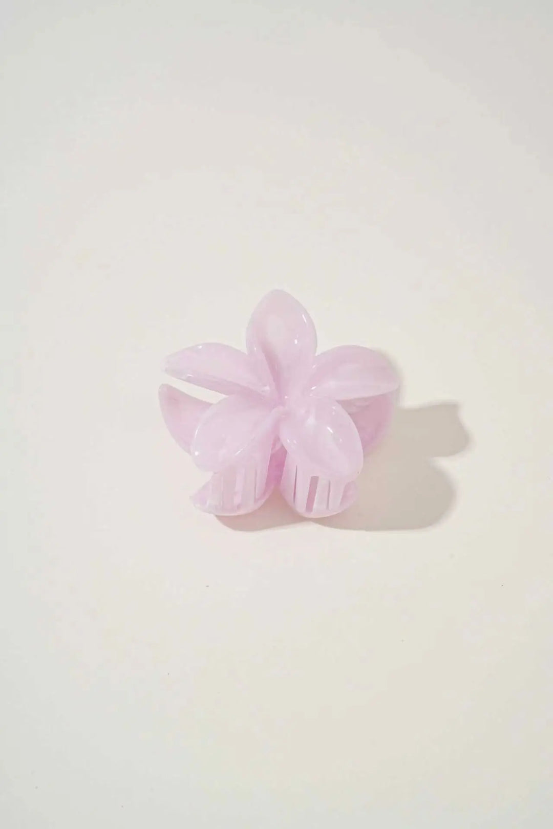 An image of a   Glossy Marbled Flower Hair Claw by  Mirra Masa