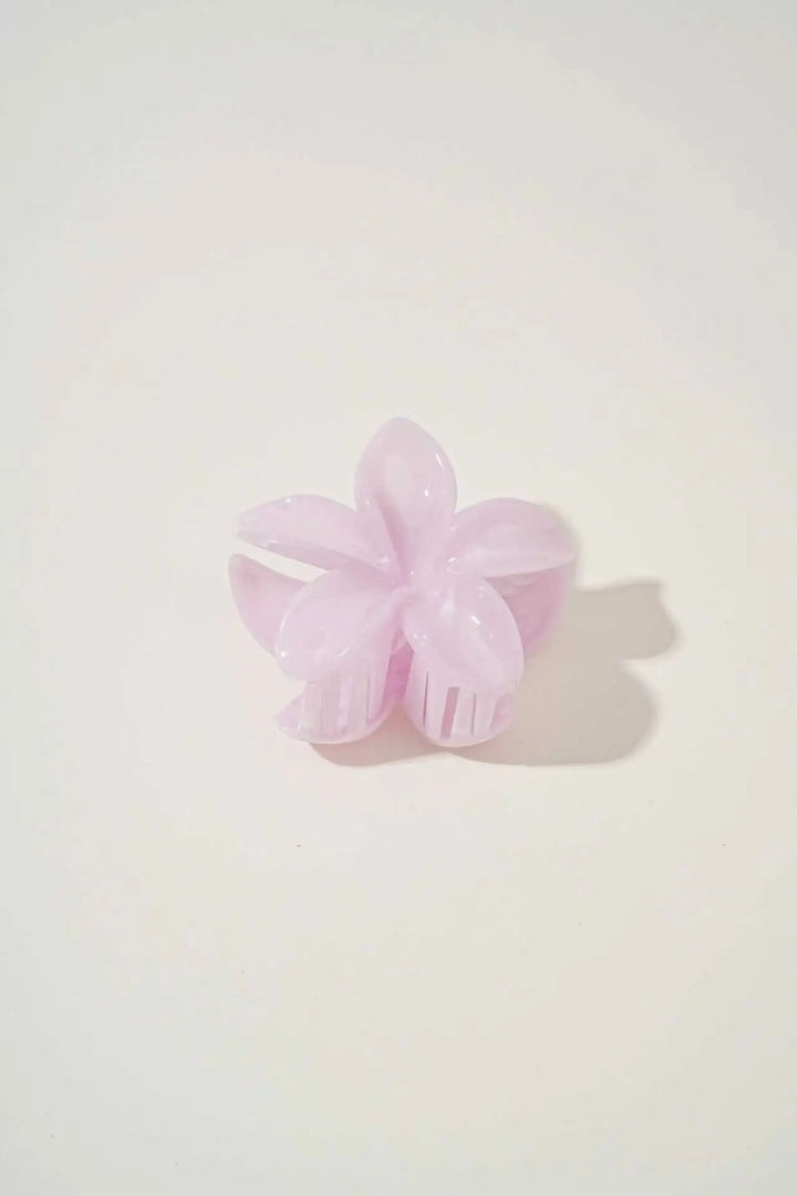 An image of a   Glossy Marbled Flower Hair Claw by  Mirra Masa