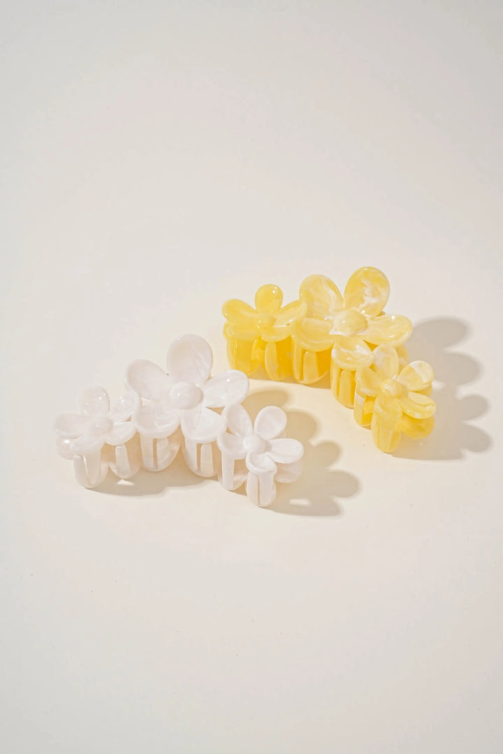 An image of a   Glossy Marbled Trio-Flower Hair Claw by  Mirra Masa