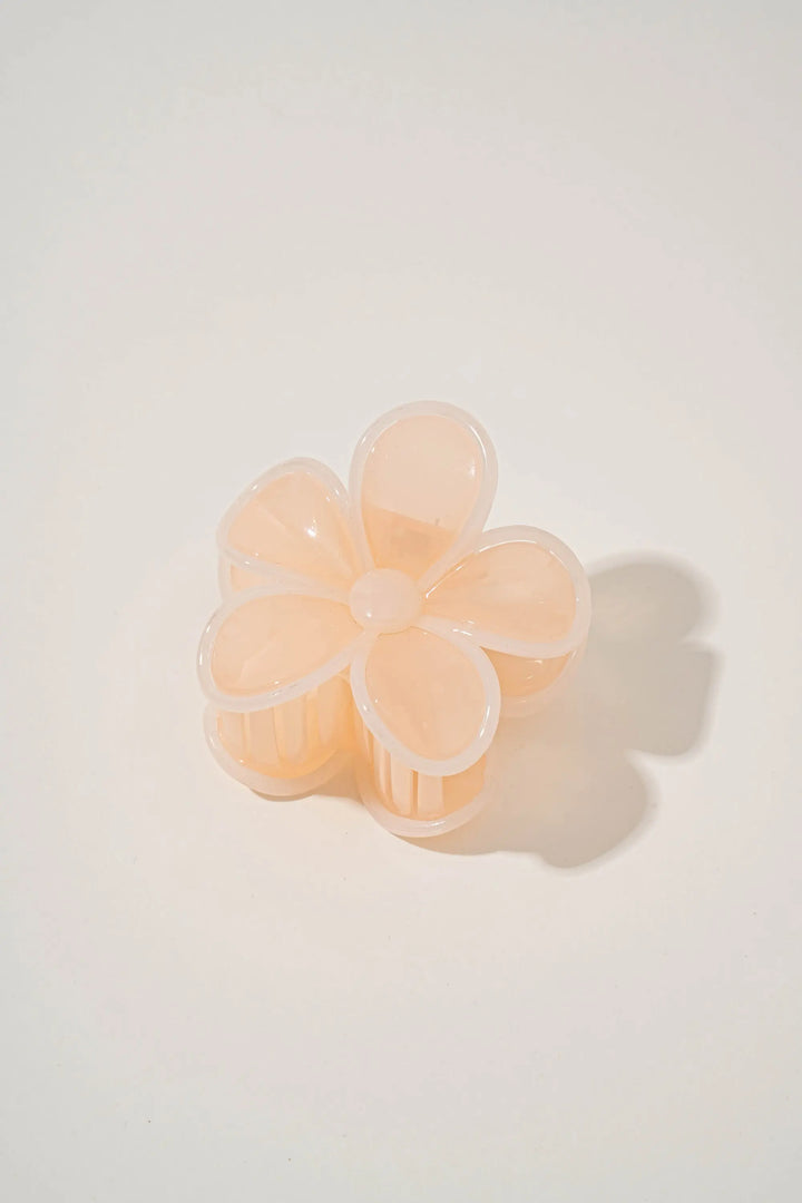 An image of a   Glossy Outlined Flower Hair Claw by  Mirra Masa