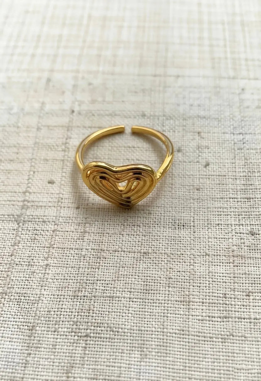 An image of a   Hollow Heart Ring Adjustable by  Mirra Masa