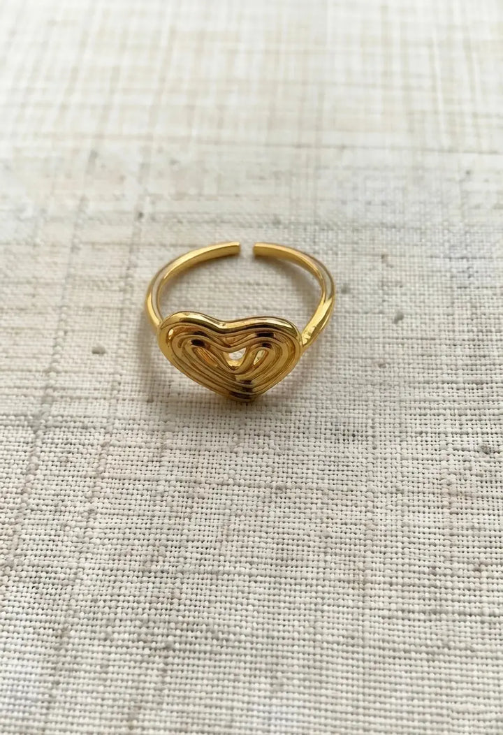 An image of a   Hollow Heart Ring Adjustable by  Mirra Masa