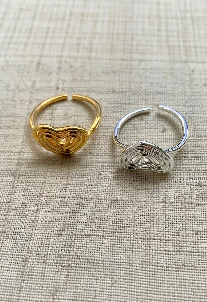 An image of a   Hollow Heart Ring Adjustable by  Mirra Masa
