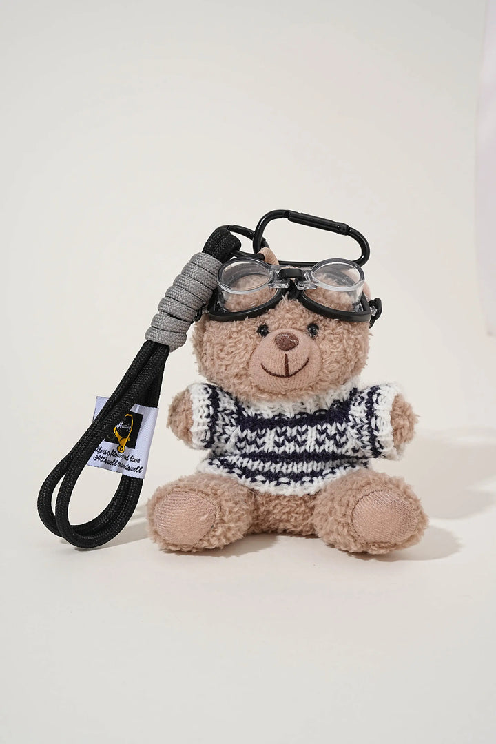 An image of a   Knit Sweater Teddy Bear Bag & Key Charm by  Mirra Masa