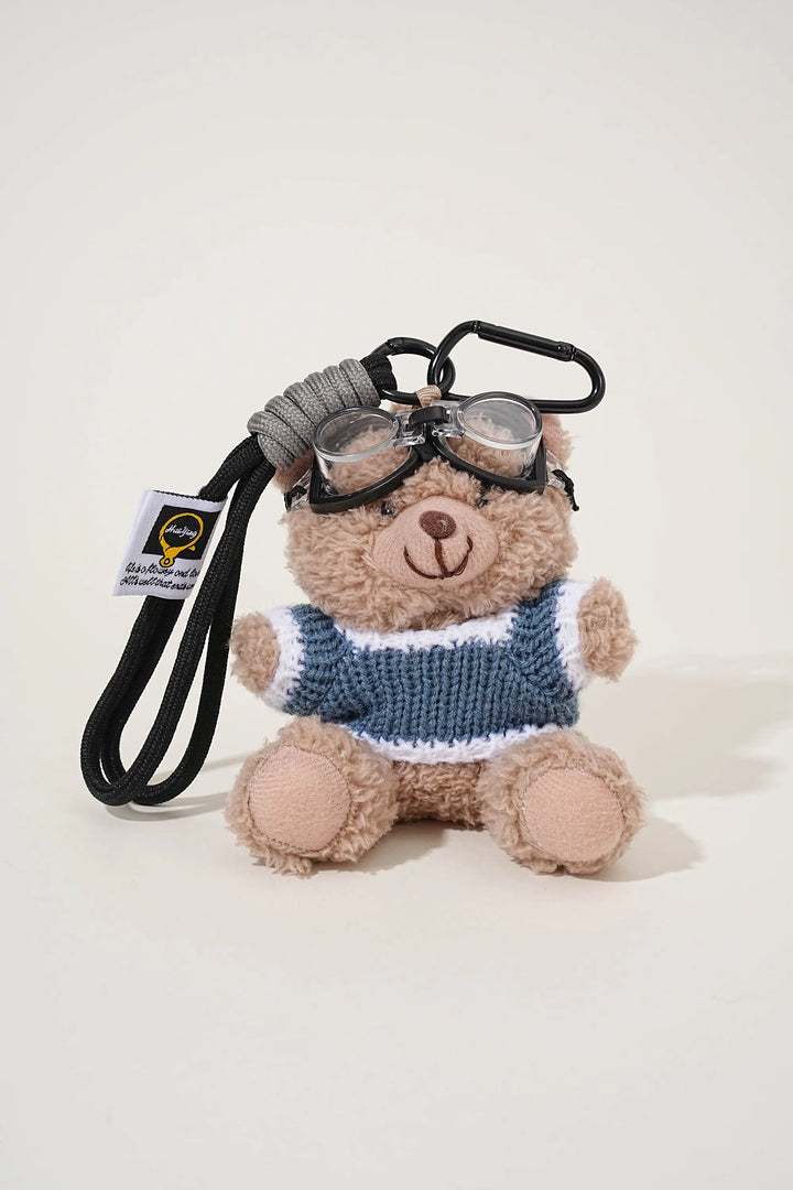 An image of a   Knit Sweater Teddy Bear Bag & Key Charm by  Mirra Masa