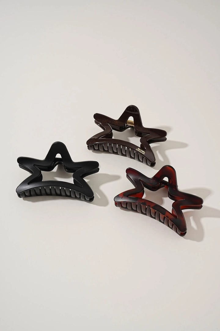 An image of a   Matte Cutout Star Claw by  Mirra Masa