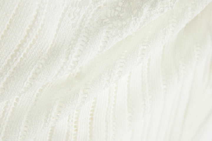 An image of a   OW83US6 Knit Cardigan by  Mirra Masa