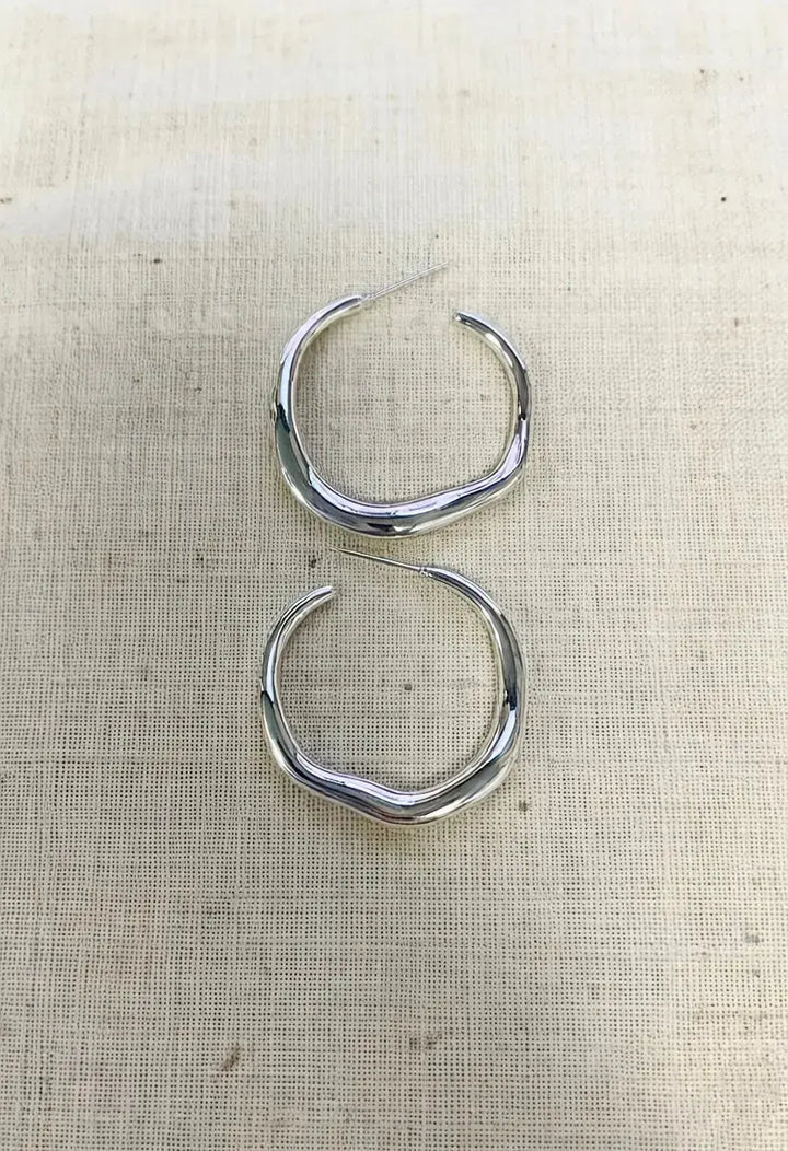 An image of a   Organic Wavy Hoop Earrings by  Mirra Masa