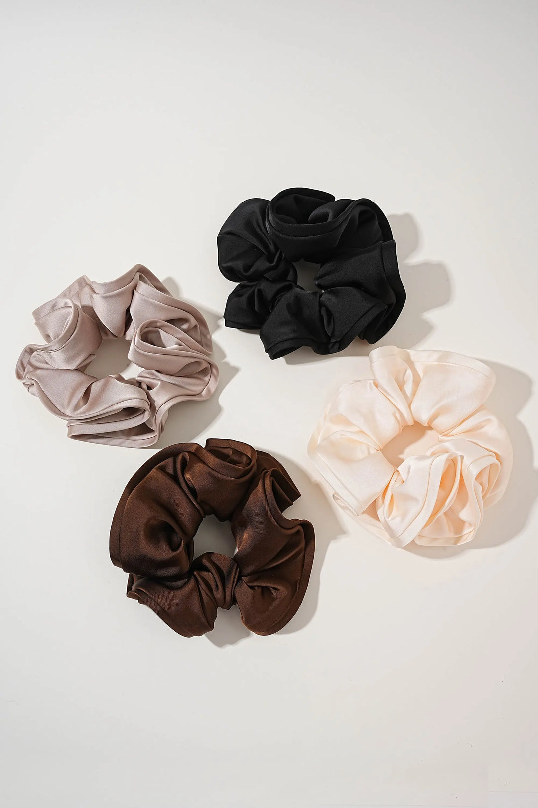 An image of a   Oversized Satin Cloud Scrunchie by  Mirra Masa