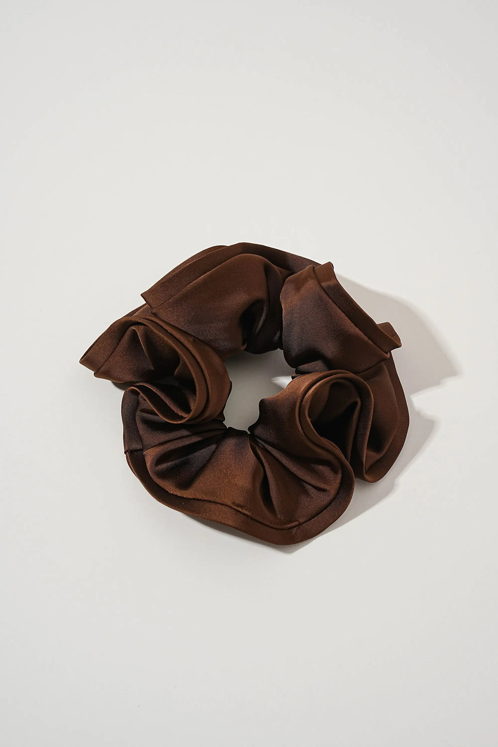 An image of a   Oversized Satin Cloud Scrunchie by  Mirra Masa