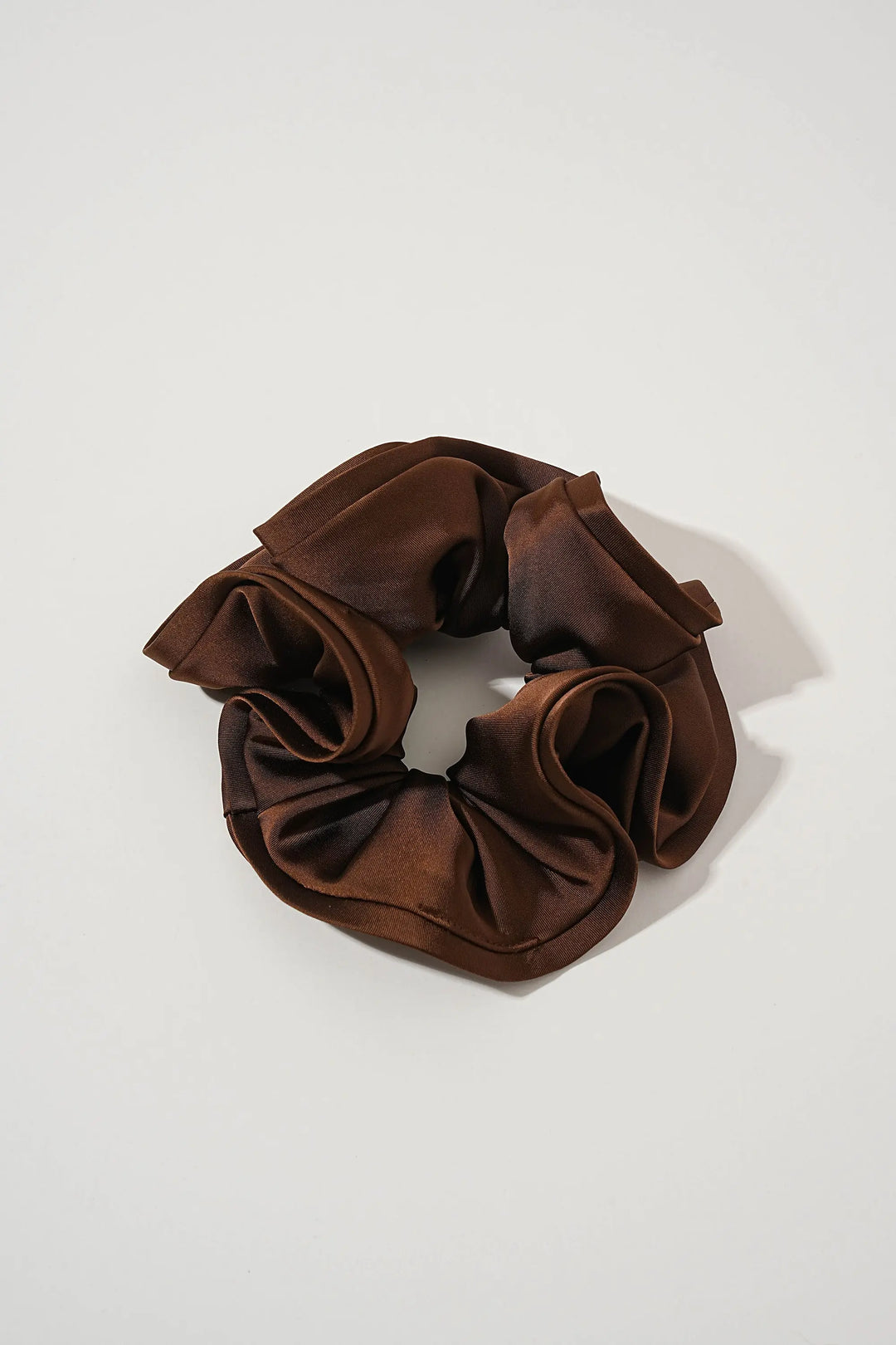 An image of a   Oversized Satin Cloud Scrunchie by  Mirra Masa