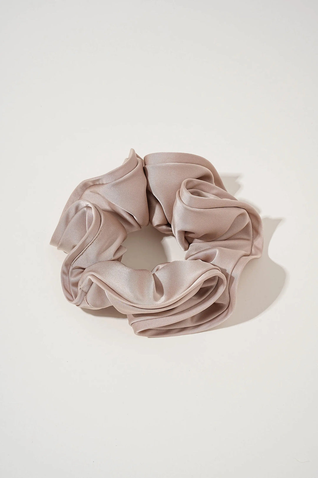 An image of a   Oversized Satin Cloud Scrunchie by  Mirra Masa
