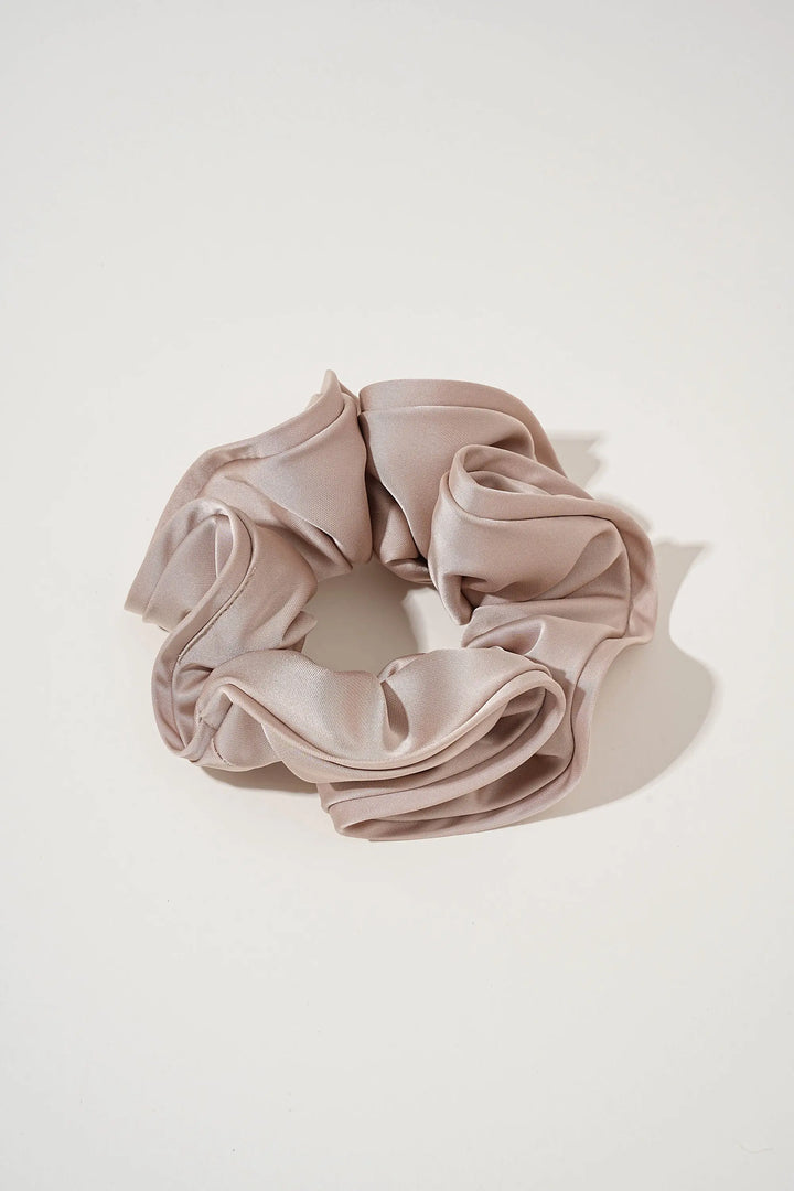 An image of a   Oversized Satin Cloud Scrunchie by  Mirra Masa