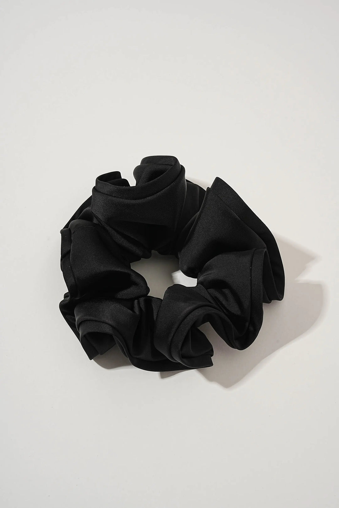 An image of a   Oversized Satin Cloud Scrunchie by  Mirra Masa