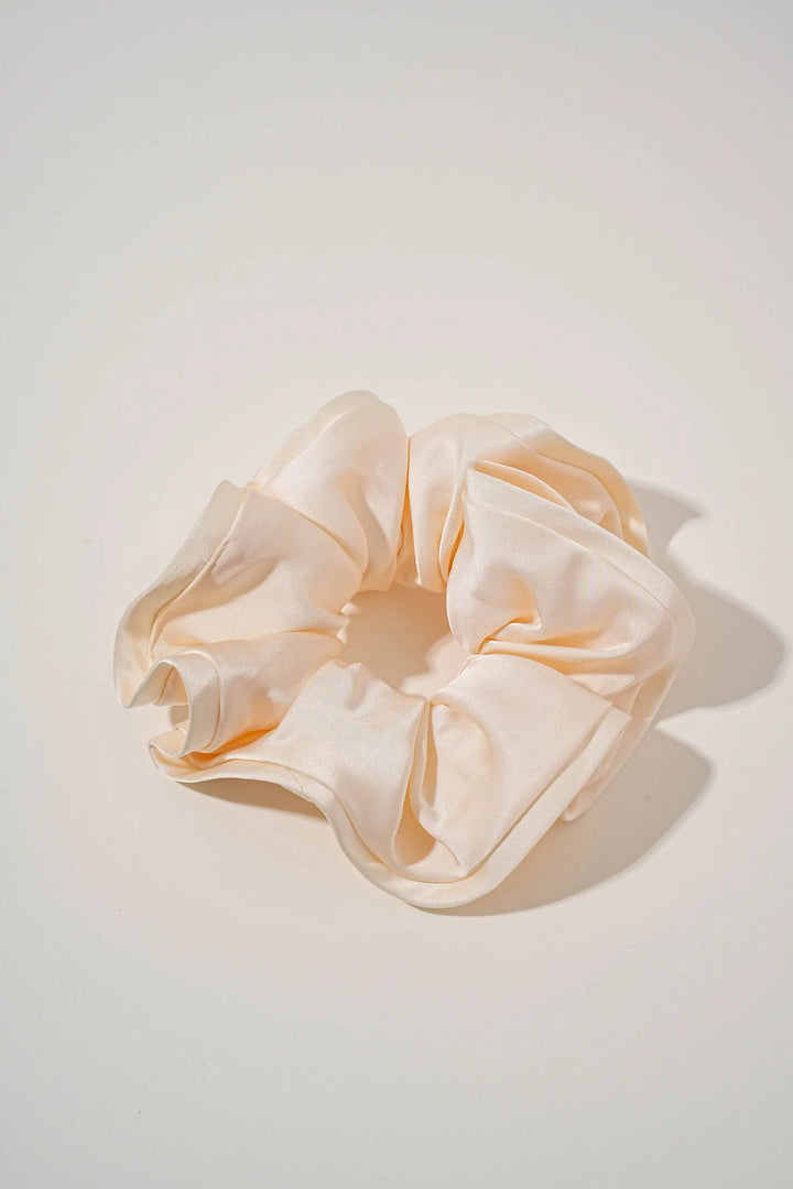 An image of a   Oversized Satin Cloud Scrunchie by  Mirra Masa