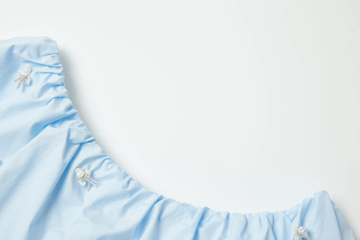 An image of a   PLW92S6 Ruffled Off-Shoulder Cropped Top by  Mirra Masa