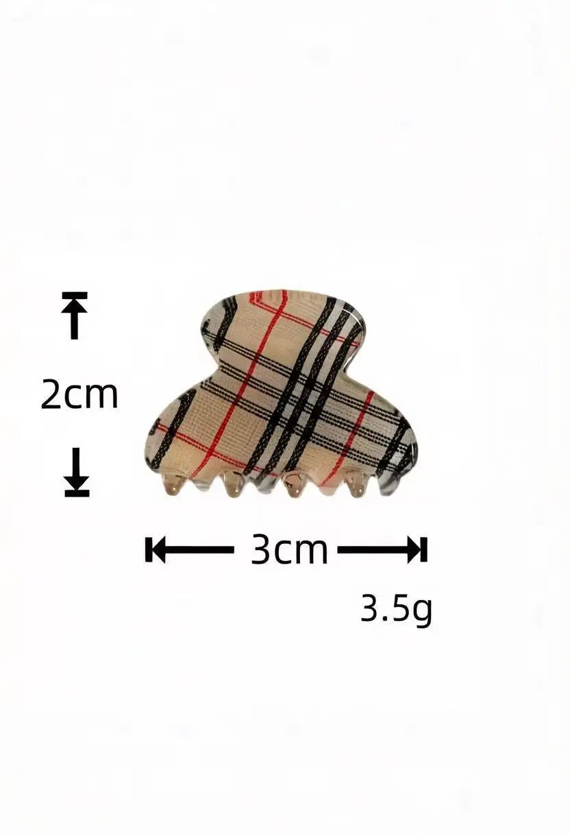 An image of a   Plaid Clover Hair Claw Mini Pair by  Mirra Masa