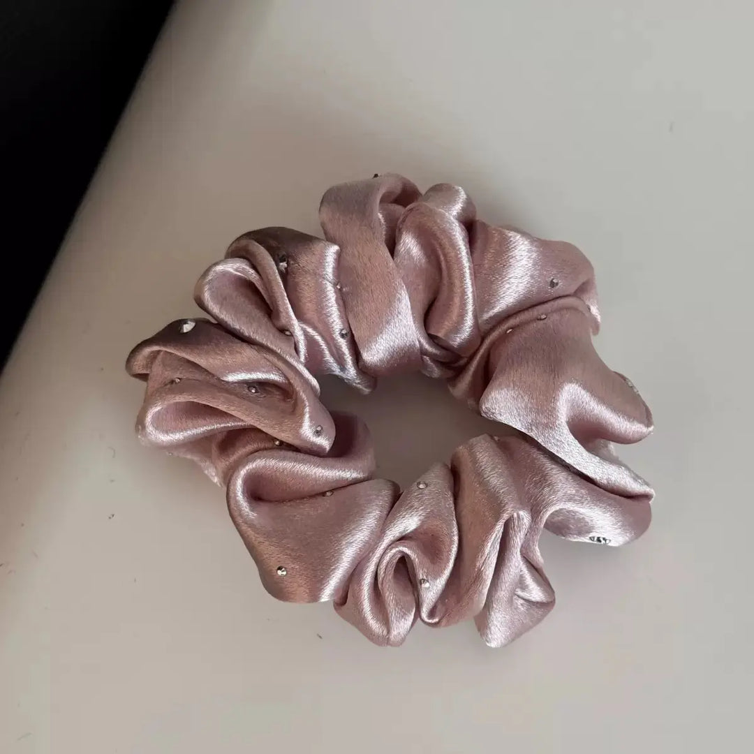 An image of a   Rhinestone Satin Scrunchie by  Mirra Masa