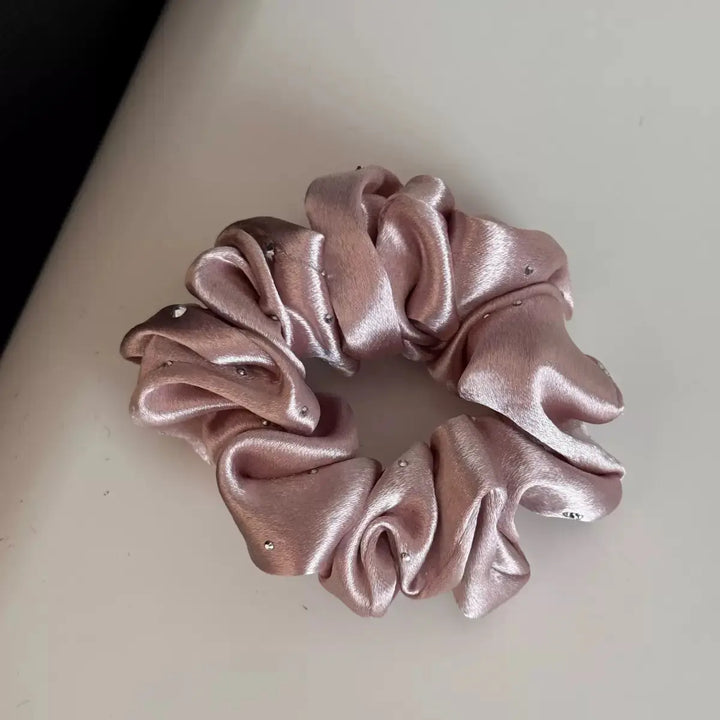 An image of a   Rhinestone Satin Scrunchie by  Mirra Masa