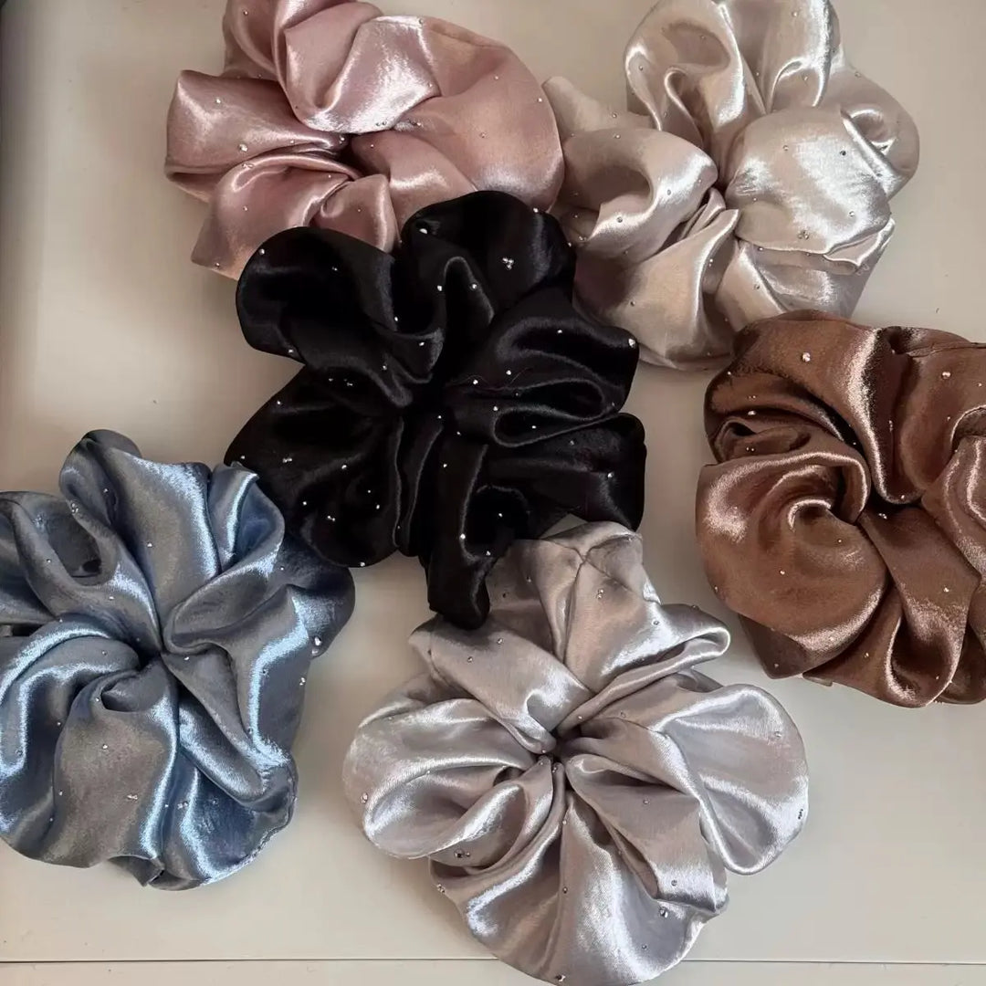 An image of a   Rhinestone Satin Scrunchie by  Mirra Masa