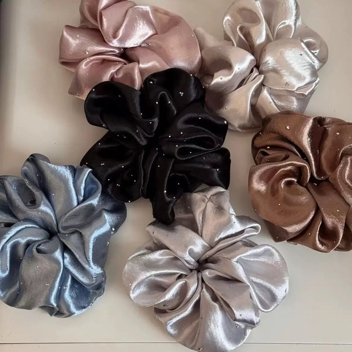 An image of a   Rhinestone Satin Scrunchie by  Mirra Masa