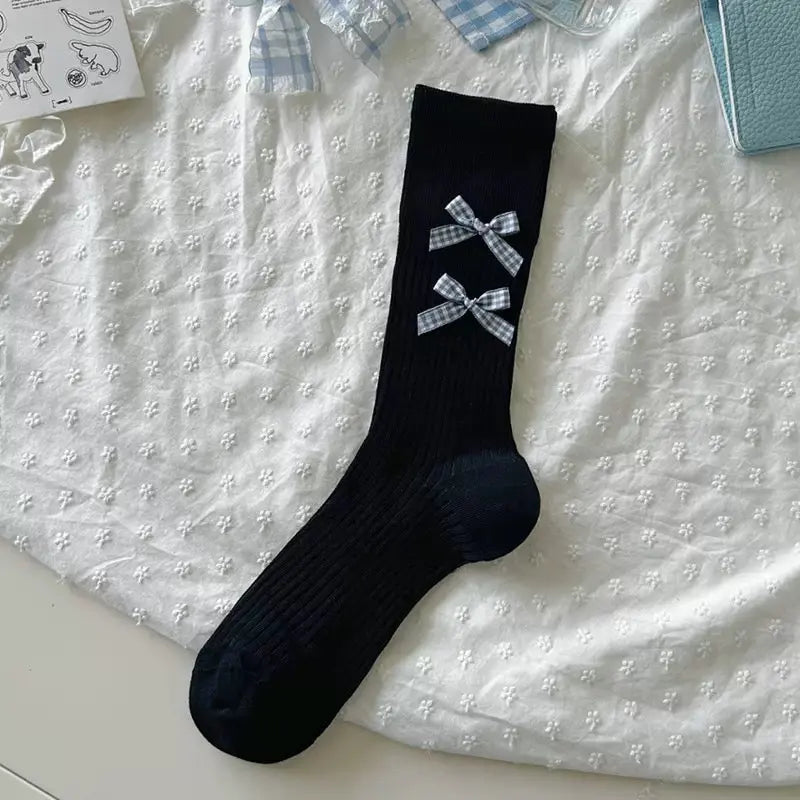 An image of a   Ribbed Bow Socks by  Mirra Masa