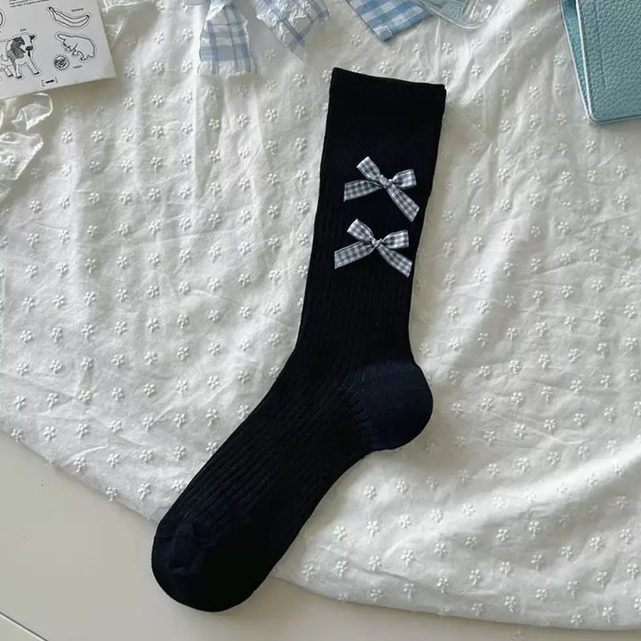 An image of a   Ribbed Bow Socks by  Mirra Masa