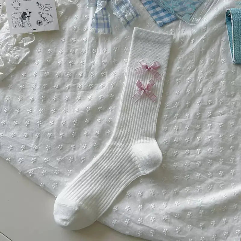 An image of a   Ribbed Bow Socks by  Mirra Masa