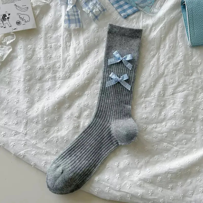 An image of a   Ribbed Bow Socks by  Mirra Masa