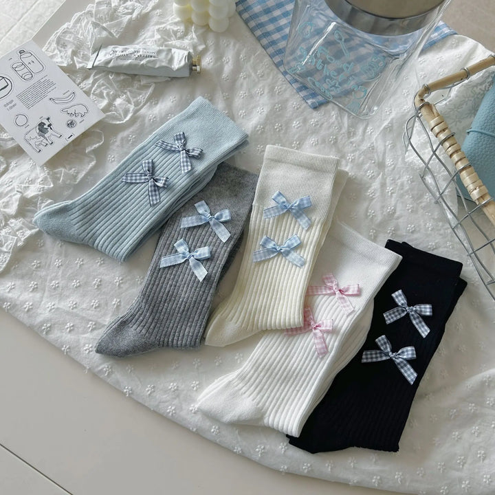 An image of a   Ribbed Bow Socks by  Mirra Masa