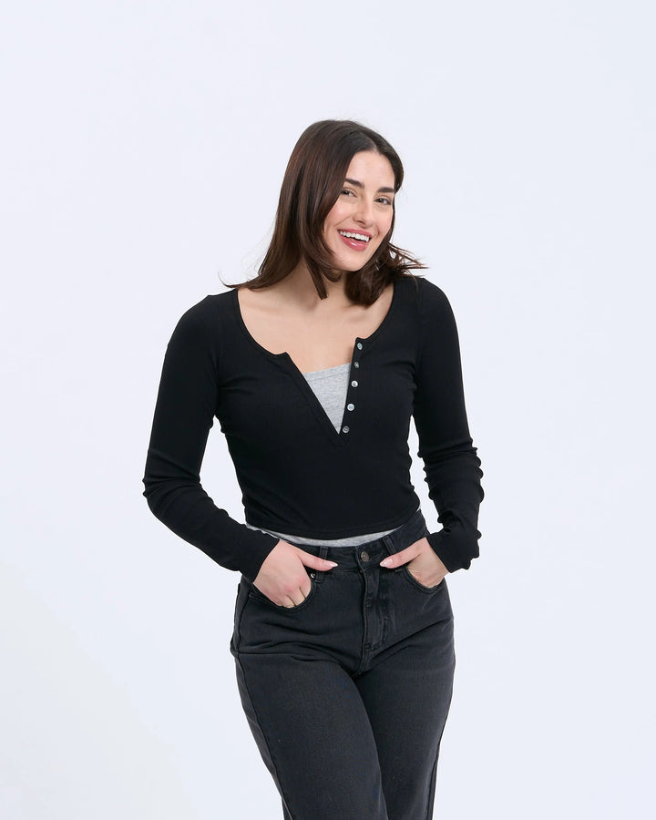 An image of a  Black-Medium S0532 Layered Knit Top by  Mirra Masa