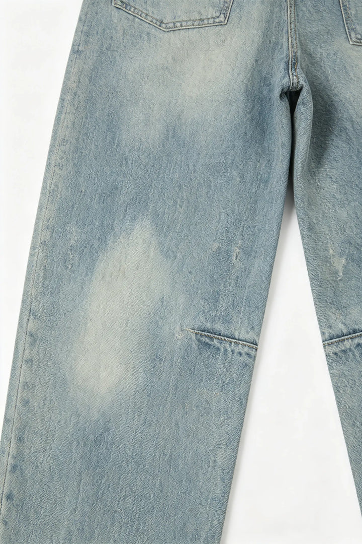 An image of a   S22918 Distressed Slit-Hem Jeans by  Mirra Masa