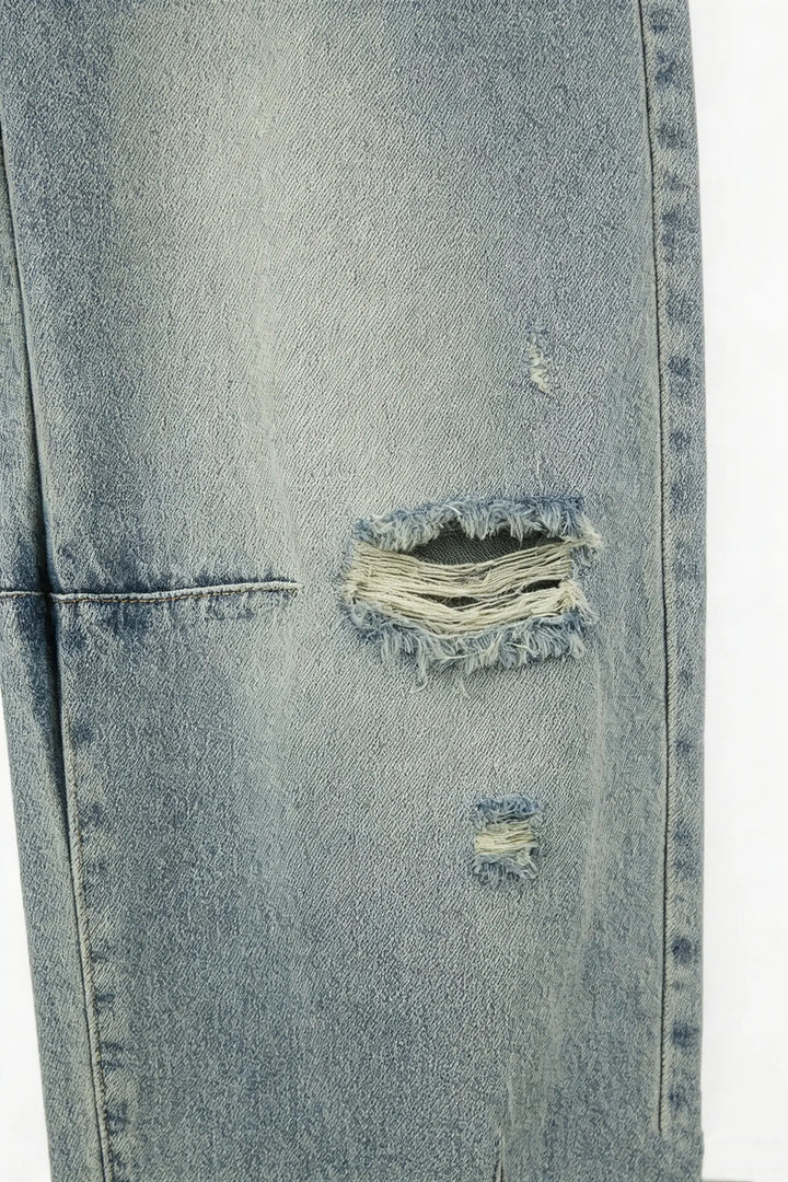 An image of a   S22918 Distressed Slit-Hem Jeans by  Mirra Masa