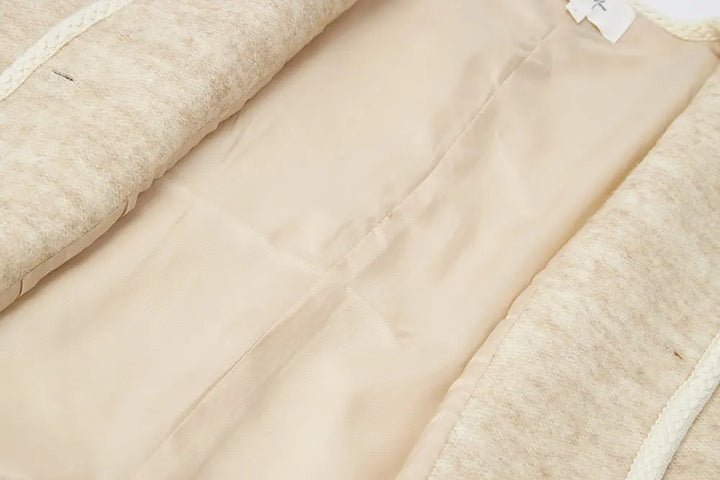 An image of a   S41584 Minimalist Wool Blend Button-Front Short Coat by  Mirra Masa