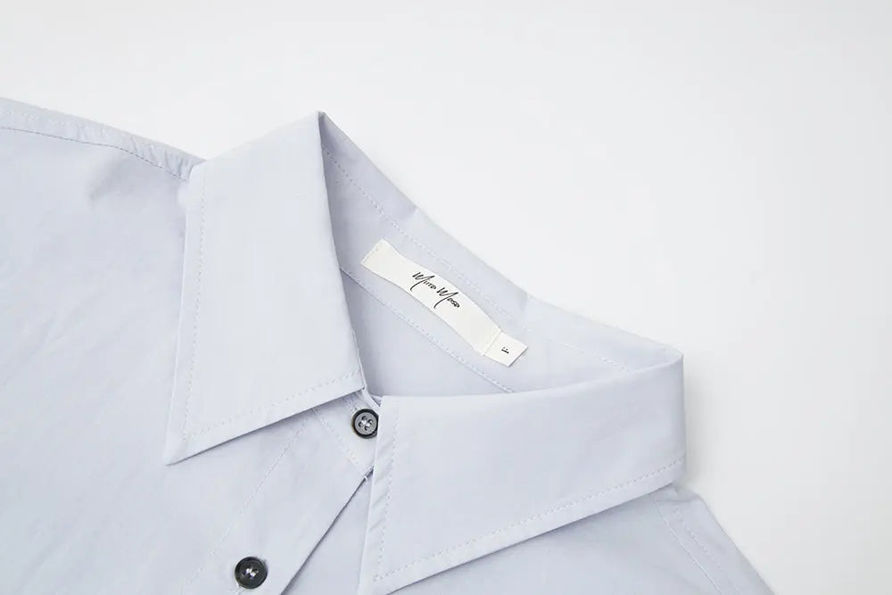 An image of a   S41838 Asymmetrical Side Twist Cotton Shirt by  Mirra Masa