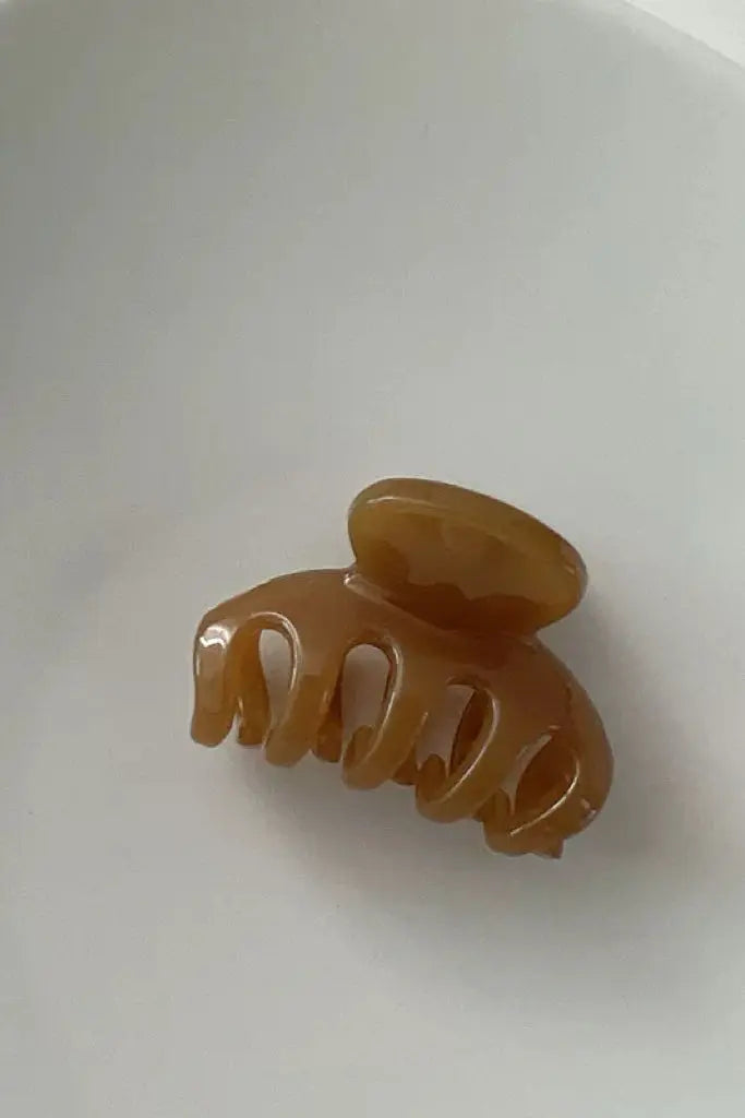 An image of a   Slim Arch Hair Claw Small by  Mirra Masa