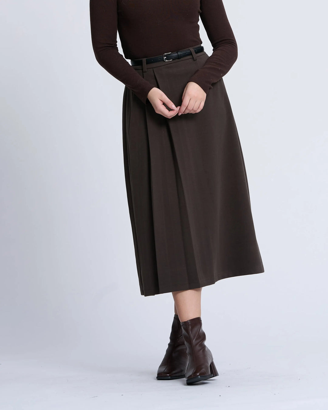 An image of a   T17 Side-Pleated Skirt by  Mirra Masa