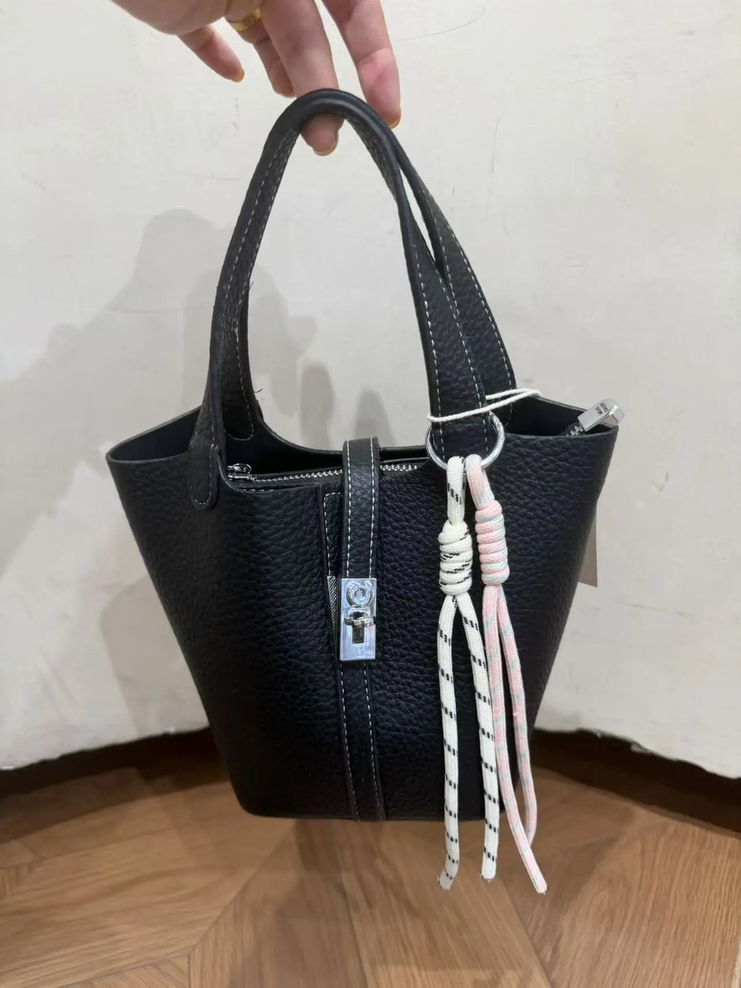 An image of a   TF0096 Lock Detail Bucket Bag by  Mirra Masa