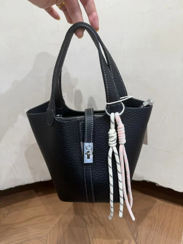 An image of a   TF0096 Lock Detail Bucket Bag by  Mirra Masa