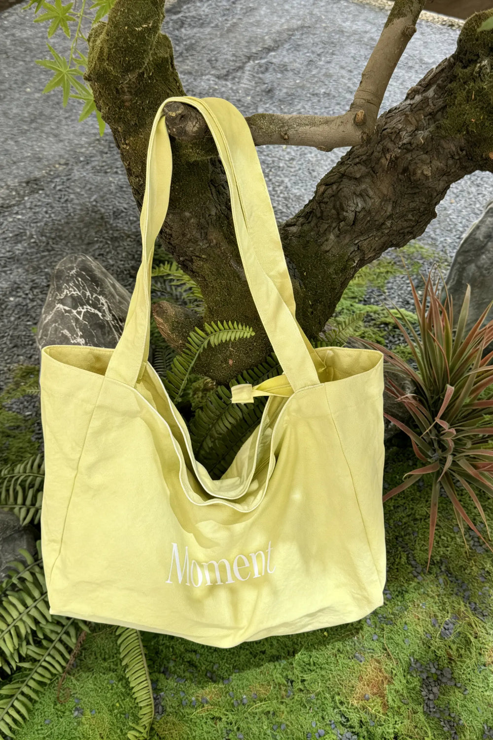 An image of a   TF1203 Graphic Text Tote Bag by  Mirra Masa