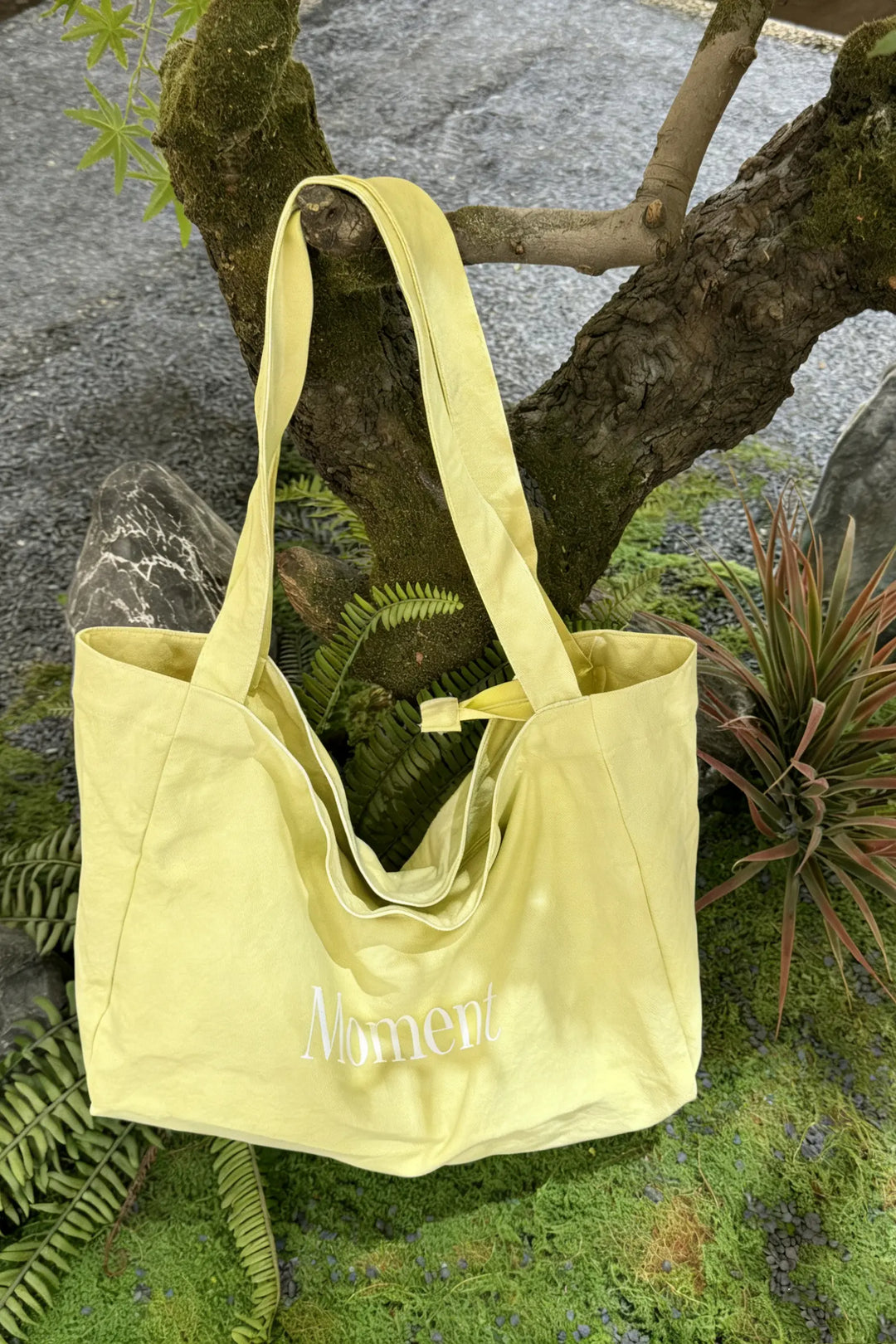 An image of a   TF1203 Graphic Text Tote Bag by  Mirra Masa