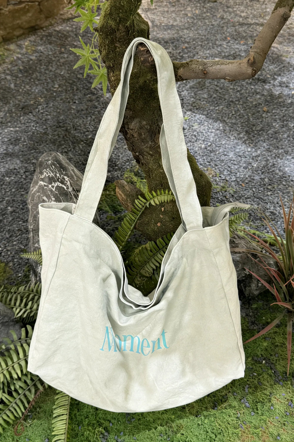 An image of a   TF1203 Graphic Text Tote Bag by  Mirra Masa