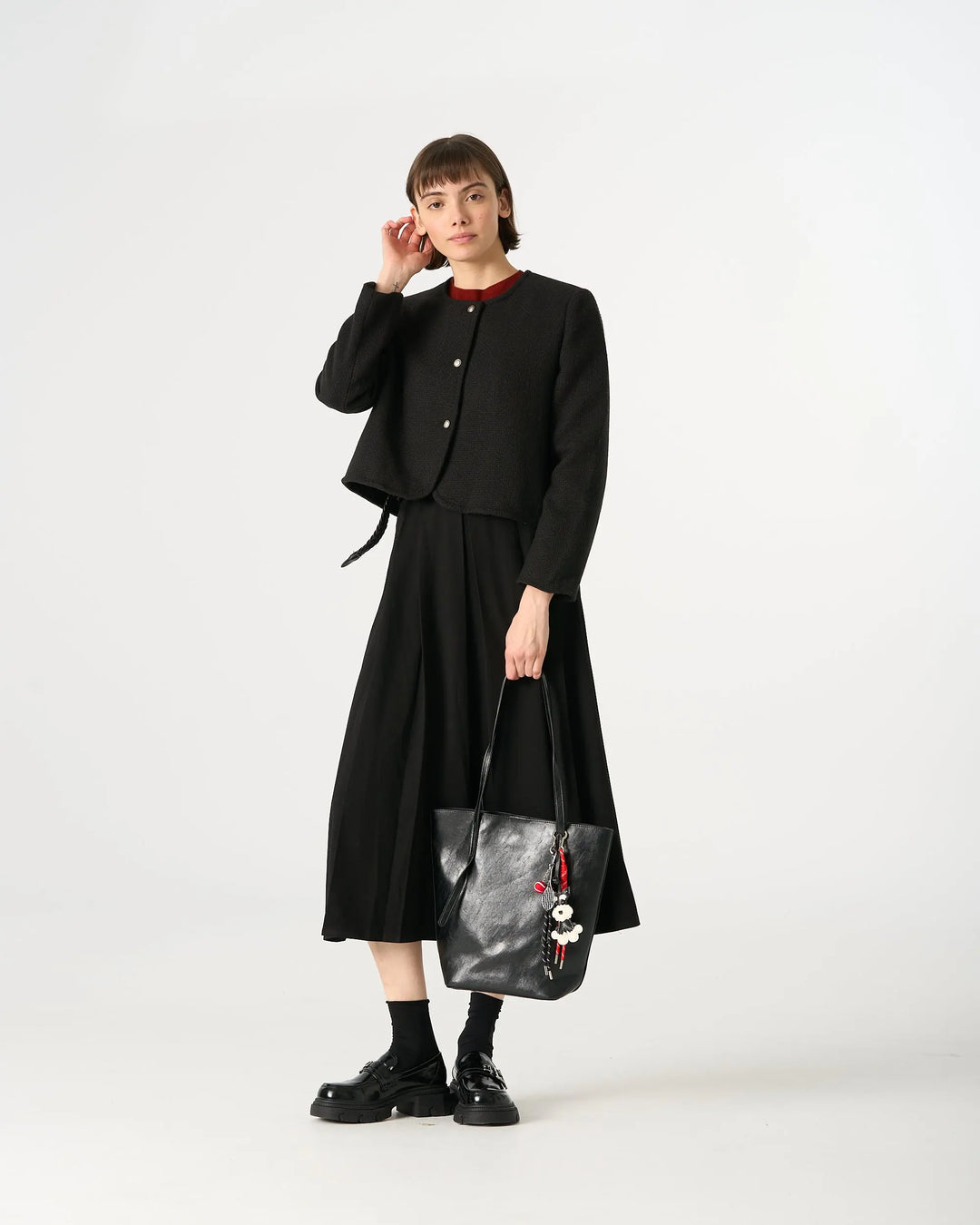 An image of a  Black TF2305 Vegan Leather Tote Bag by  Mirra Masa