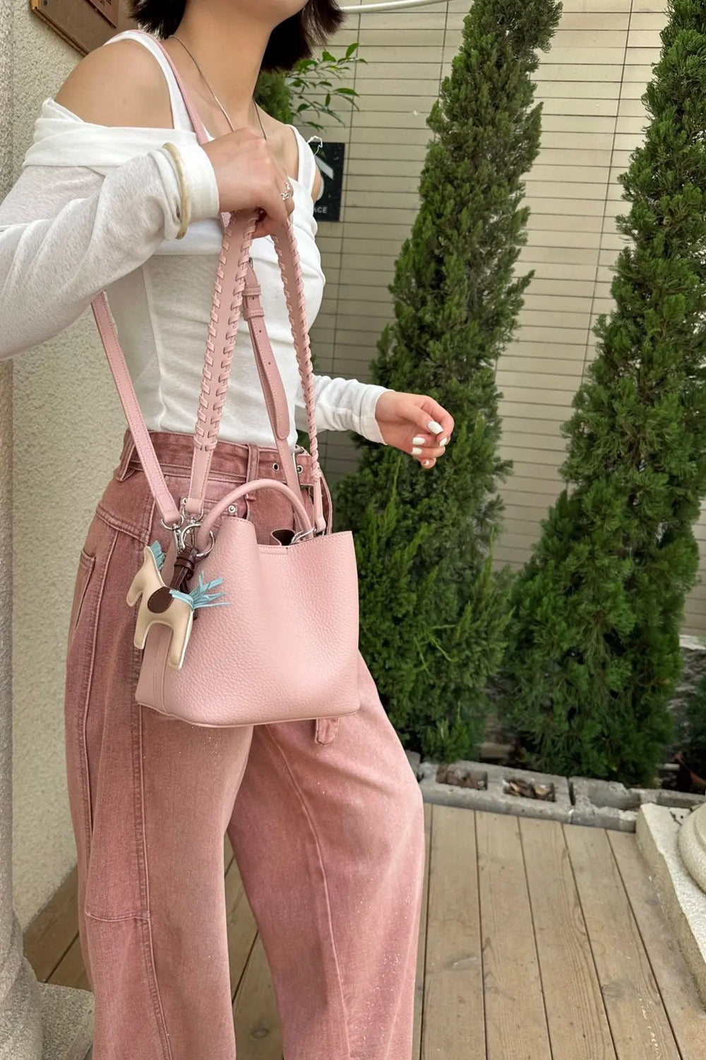 An image of a   TF2561 Braided-Strap Bucket Bag by  Mirra Masa