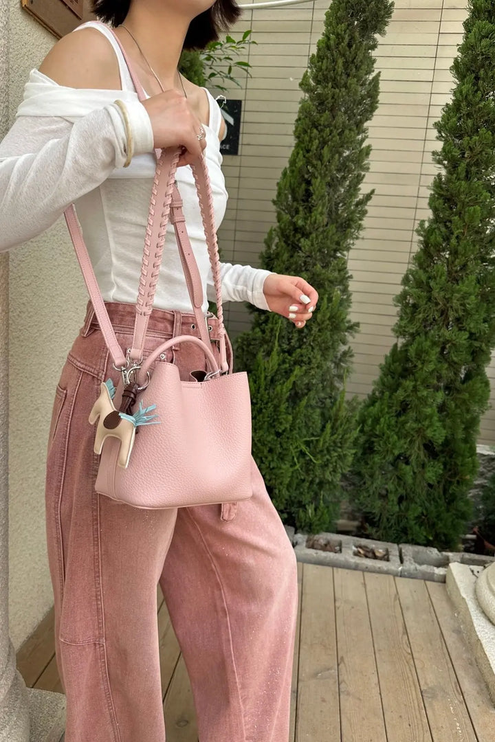 An image of a   TF2561 Braided-Strap Bucket Bag by  Mirra Masa