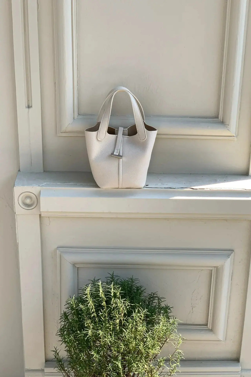 An image of a   TF5318 Structured Mini Tote by  Mirra Masa