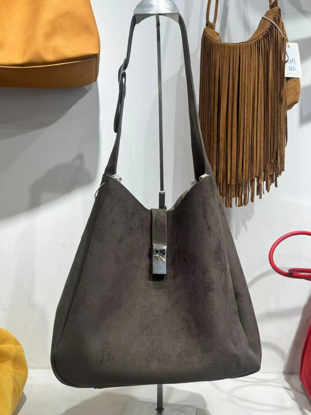 An image of a  Brown TF5806 Suede Hobo Bag by  Mirra Masa