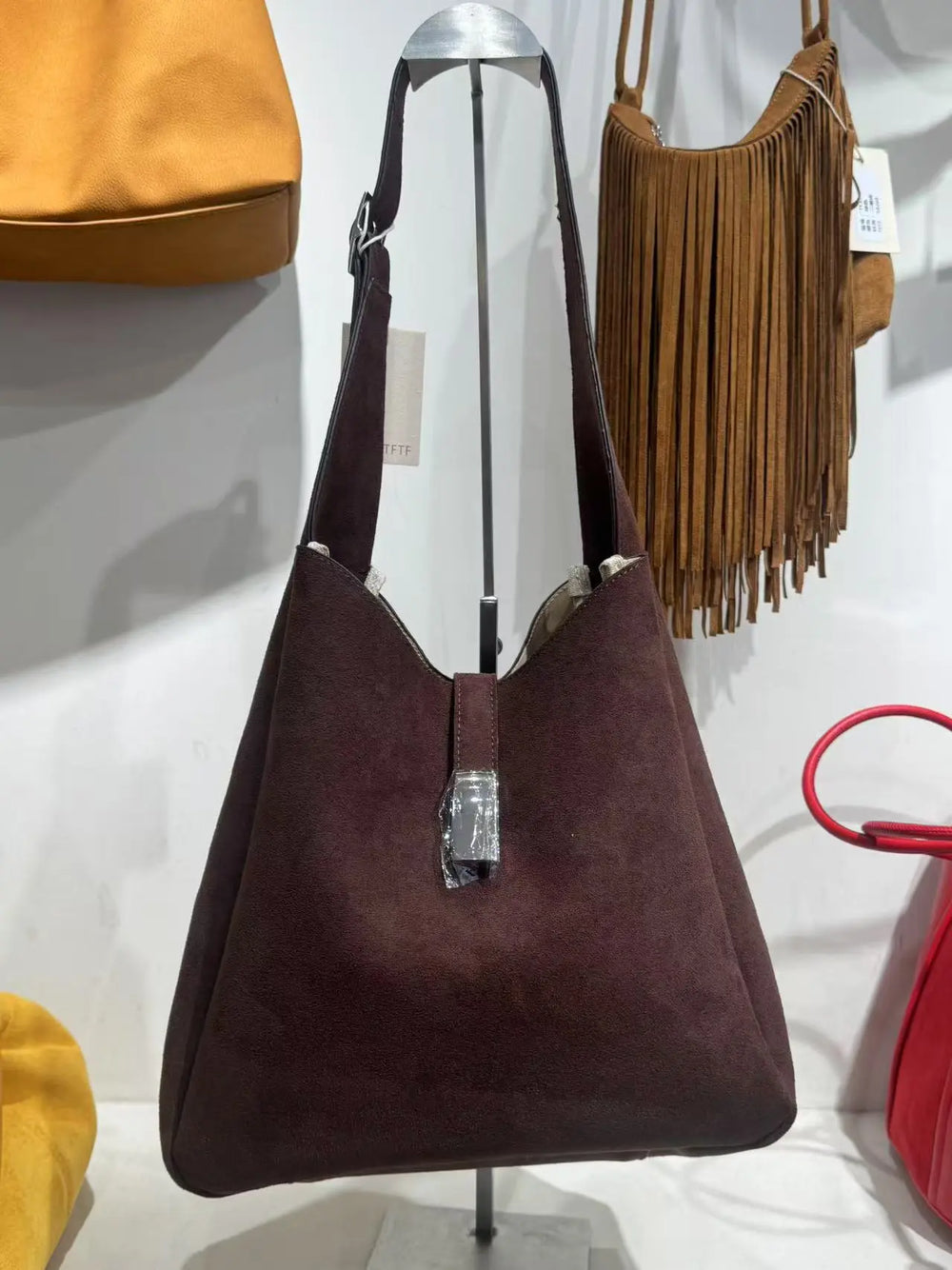 An image of a  Dark Khaki TF5806 Suede Hobo Bag by  Mirra Masa